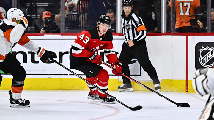 Apr 13, 2024; Philadelphia, Pennsylvania, USA; New Jersey Devils defenseman Luke Hughes (43) controls the puck against the Philadelphia Flyers in the second period at Wells Fargo Center. Mandatory Credit: Kyle Ross-Imagn Images