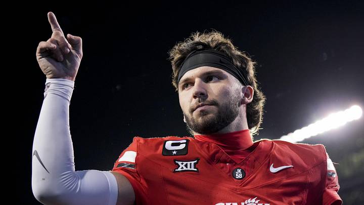 Cincinnati Bearcats quarterback Brendan Sorsby points to fans