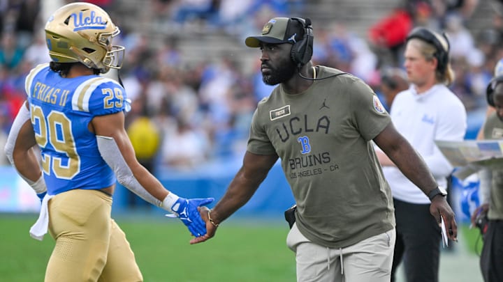 Nov 30, 2024; Pasadena, California, USA; UCLA Bruins head coach DeShaun Foster greets UCLA Bruins running back Anthony Frias II (29) as he returns to the bench during the third quarter against the Fresno State Bulldogs at Rose Bowl. Mandatory Credit: Robert Hanashiro-Imagn Images