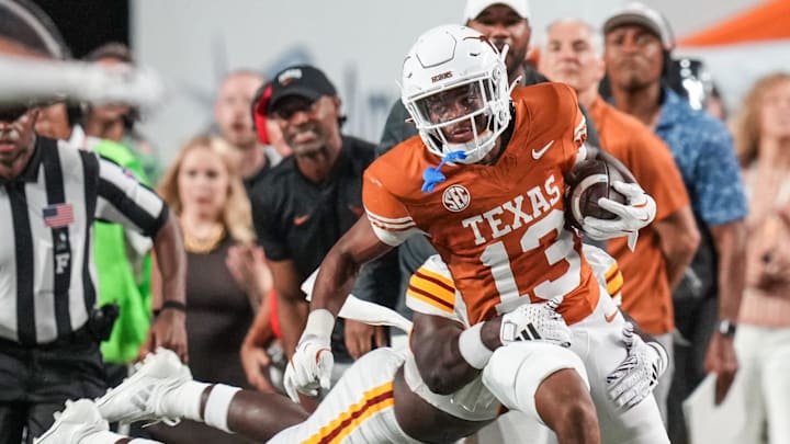 Texas Longhorns defensive back Jay'Vion Cole (13) runs the ball forward following an interception as the Texas Longhorns take on ULM at Darrell K Royal-Texas Memorial Stadium in Austin Saturday, Sept. 21, 2024.