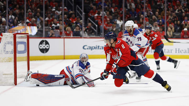 Jan 4, 2025; Washington, District of Columbia, USA; Washington Capitals left wing Alex Ovechkin (8) scores a goal on New York Rangers goaltender Jonathan Quick (32) in the third period at Capital One Arena. Mandatory Credit: Geoff Burke-Imagn Images