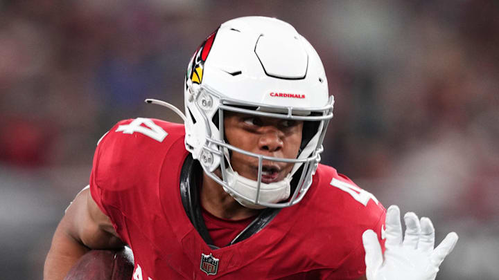 Jan 7, 2024; Glendale, Arizona, USA; Arizona Cardinals wide receiver Rondale Moore (4) runs against the Seattle Seahawks during the second half at State Farm Stadium. Mandatory Credit: Joe Camporeale-Imagn Images
