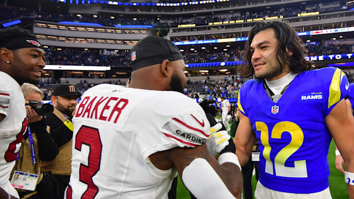 Jan 4, 2026; Inglewood, California, USA;  Los Angeles Rams wide receiver Puka Nacua (12) with Arizona Cardinals safety Budda Baker (3) on the field following a game at SoFi Stadium. Mandatory Credit: Gary A. Vasquez-Imagn Images