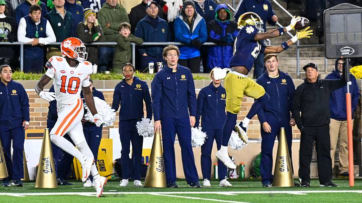 Nov 5, 2022; South Bend, Indiana, USA; Notre Dame Fighting Irish cornerback Benjamin Morrison (20) intercepts a pass intended for Clemson Tigers wide receiver Joseph Ngata (10) in the fourth quarter at Notre Dame Stadium. Morrison returned the interception for a touchdown. Notre Dame won 35-14. Nov 5, 2022; South Bend, Indiana, USA; Notre Dame Fighting Irish cornerback Benjamin Morrison (20) intercepts a pass intended for Clemson Tigers wide receiver Joseph Ngata (10) in the fourth quarter at Notre Dame Stadium. Morrison returned the interception for a touchdown. Notre Dame won 35-14.