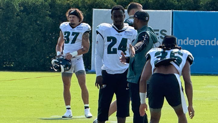 Rookie Drew Mukuba gets instruction from DB coach Christian Parker during Day 8 of Eagles training camp.