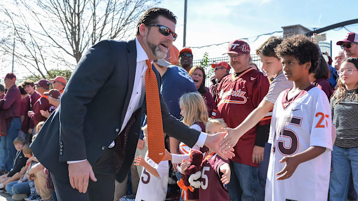 Nov 9, 2024; Blacksburg, Virginia, USA;  Virginia Tech Hokies head coach Brent Pry greets fans before the game against the Clemson Tigers as he enters Lane Stadium. Mandatory Credit: Brian Bishop-Imagn Images