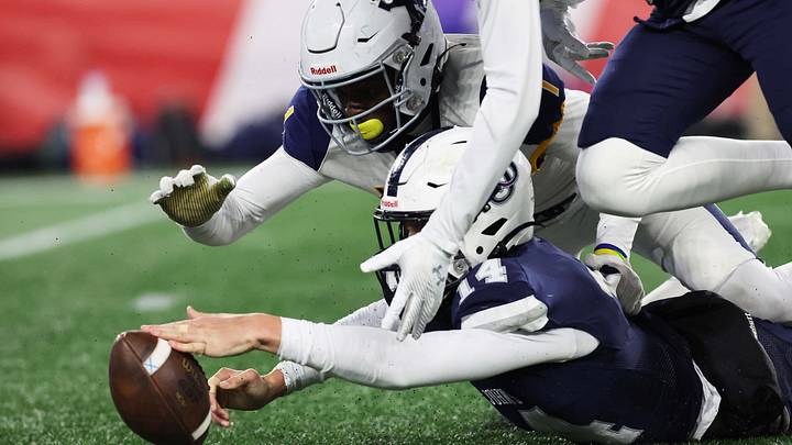 Xaverian special teams player Caleb Brown go after a loose ball as St. John's Prep's Jimmy Nardone fumbled the ball but recovered it during the Division 1 state title game at Gillette Stadium on Wednesday, Nov. 29, 2023. Xaverian special teams player Caleb Brown go after a loose ball as St. John's Prep's Jimmy Nardone fumbled the ball but recovered it during the Division 1 state title game at Gillette Stadium on Wednesday, Nov. 29, 2023.