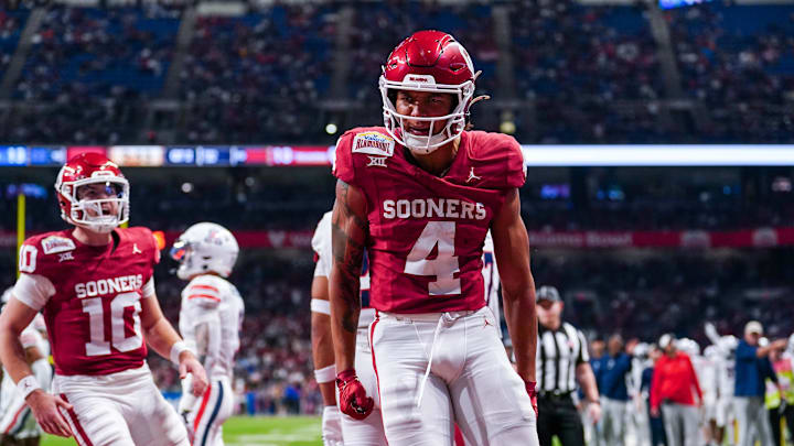 Dec 28, 2023; San Antonio, TX, USA;  Oklahoma Sooners wide receiver Nic Anderson (4) celebrates a touchdown catch in the first half against the Arizona Wildcats at Alamodome. Mandatory Credit: Daniel Dunn-Imagn Images