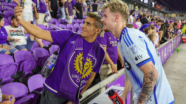 Jul 26, 2024; Orlando, Florida, USA; CF Montreal defender Grayson Doody (27) poses for a picture with a fan after the game against Orlando City during the second half at INTER&CO Stadium. Mandatory Credit: Mike Watters-USA TODAY Sports
