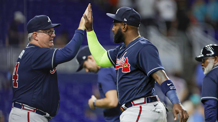 Atlanta Braves designated hitter Marcell Ozuna (right) celebrates with hitting coach Kevin Seitzer after a win against the Miami Marlins on May 20, 2023, at loanDepot Park.