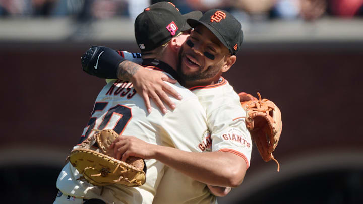 Aug 17, 2025; San Francisco, California; San Francisco Giants first baseman Dominic Smith (7) celebrates with San Francisco Giants third baseman Christian Koss (50) after defeating the Tampa Bay Rays in the ninth inning at Oracle Park. 