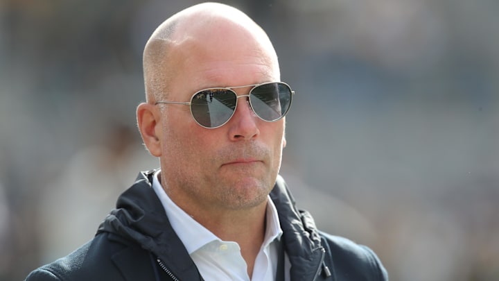 Nov 17, 2024; Pittsburgh, Pennsylvania, USA;  Baltimore Ravens general manager Eric DeCosta watches warm ups against the Pittsburgh Steelers at Acrisure Stadium. Mandatory Credit: Charles LeClaire-Imagn Images