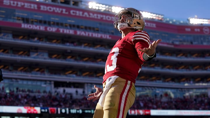 Dec 8, 2024; Santa Clara, California, USA; San Francisco 49ers quarterback Brock Purdy (13) reacts after rushing for a touchdown against the Chicago Bears in the second quarter at Levi's Stadium. The play was later called back for offensive holding. Mandatory Credit: Cary Edmondson-Imagn Images