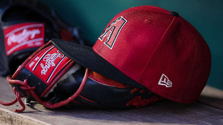 Jun 7, 2023; Washington, District of Columbia, USA; A general view of an Arizona Diamondbacks hat and Rawlings glove in the dugout during the fifth inning of the game against the Washington Nationals at Nationals Park. 