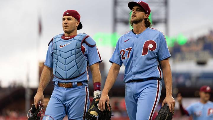 Philadelphia Phillies starting pitcher Aaron Nola (27) and catcher J.T. Realmuto (10) walk to the dugout.