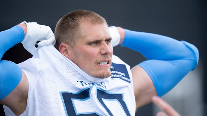 Tennessee Titans outside linebacker Cody Barton removes his jersey after OTAs.
