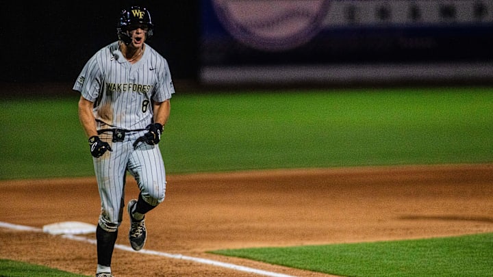 May 24, 2024; Charlotte, NC, USA; Wake Forest outfielder Nick Kurtz (8) celebrates a two run homer in the twelfth inning against the North Carolina Tar Heels during the ACC Baseball Tournament at Truist Field. Mandatory Credit: Scott Kinser-Imagn Images