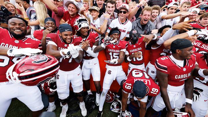 Oct 10, 2026; Gainesville, Florida, USA;  South Carolina Gamecocks linebacker Donovan Darden (15) and South Carolina Gamecocks defensive back Jaquel Holman (18) celebrate with teammates and fans after a game against the Florida Gators at Ben Hill Griffin Stadium.  Mandatory Credit: Matt Pendleton-Imagn Images