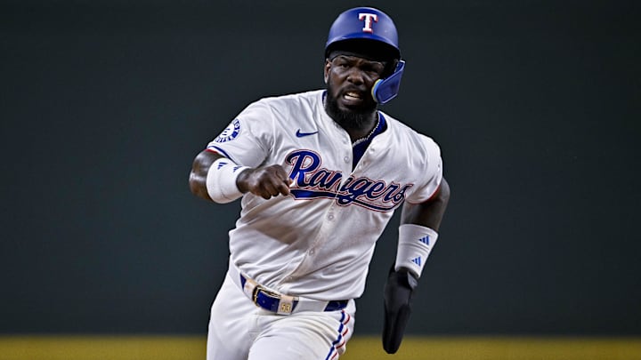 Aug 15, 2024; Arlington, Texas, USA; Texas Rangers right fielder Adolis Garcia (53) runs to third base during the third inning against the Minnesota Twins at Globe Life Field. Mandatory Credit: Jerome Miron-Imagn Images