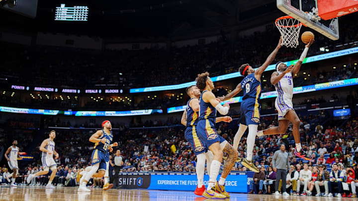 Feb 5, 2023; New Orleans, Louisiana, USA; Sacramento Kings guard Terence Davis (3) shoots the ball against New Orleans Pelicans forward Naji Marshall (8) during the first quarter at Smoothie King Center. Mandatory Credit: Andrew Wevers-Imagn Images