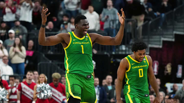 Mar 15, 2024; Las Vegas, NV, USA; Oregon Ducks center N'Faly Dante (1) and guard Kario Oquendo (0).