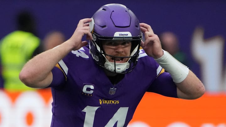 Oct 6, 2024; London, United Kingdom; Minnesota Vikings quarterback Sam Darnold (14) prepares to take the snap against the New York Jets in the first half at Tottenham Hotspur Stadium. Mandatory Credit: Kirby Lee-Imagn Images