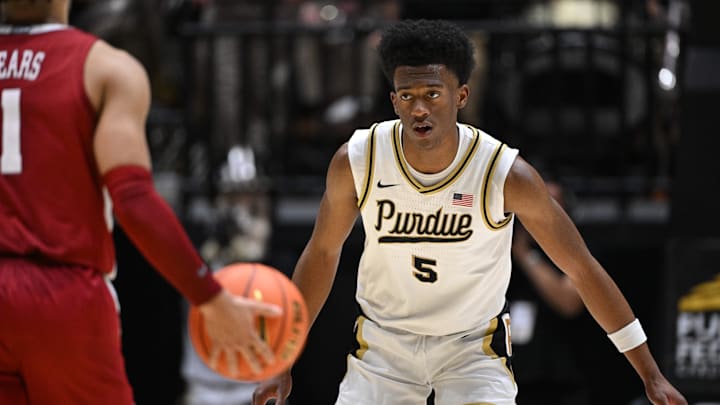 Purdue Boilermakers guard Myles Colvin (5) defends against Alabama Crimson Tide guard Mark Sears (1) 