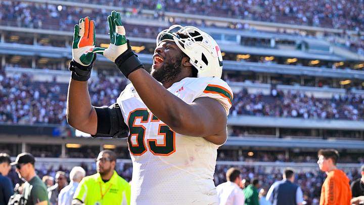 Dec 20, 2025; College Station, TX, USA; Miami Hurricanes offensive lineman Samson Okunlola (63) celebrates the Hurricanes win over the Texas A&M Aggies at Kyle Field. Mandatory Credit: Jerome Miron-Imagn Images Dec 20, 2025; College Station, TX, USA; Miami Hurricanes offensive lineman Samson Okunlola (63) celebrates the Hurricanes win over the Texas A&M Aggies at Kyle Field. Mandatory Credit: Jerome Miron-Imagn Images