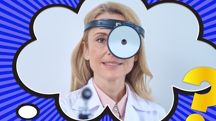 A doctor with the latest in medical technology: A head mirror.