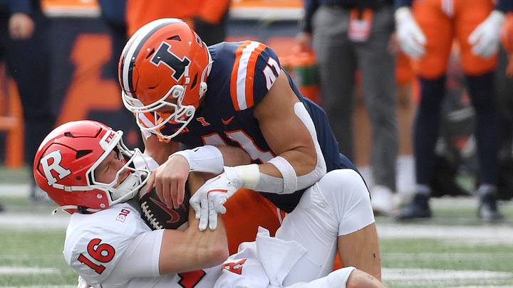 Nov 1, 2025; Champaign, Illinois, USA; Illinois Fighting Illini linebacker James Kreutz (41) sacks Rutgers Scarlet Knights quarterback Athan Kaliakmanis (16) during the second half at Memorial Stadium. Mandatory Credit: Ron Johnson-Imagn Images Nov 1, 2025; Champaign, Illinois, USA; Illinois Fighting Illini linebacker James Kreutz (41) sacks Rutgers Scarlet Knights quarterback Athan Kaliakmanis (16) during the second half at Memorial Stadium. Mandatory Credit: Ron Johnson-Imagn Images