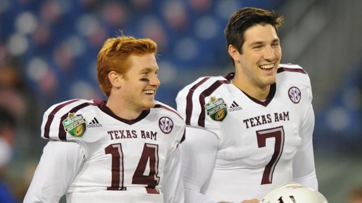 Dec 30, 2015; Nashville, TN, USA; Texas A&M Aggies quarterbacks Conner McQueen (14) and Jake Hubenak (7) prior to the game against the Louisville Cardinals in the 2015 Music City Bowl at Nissan Stadium. Mandatory Credit: Christopher Hanewinckel-Imagn Images