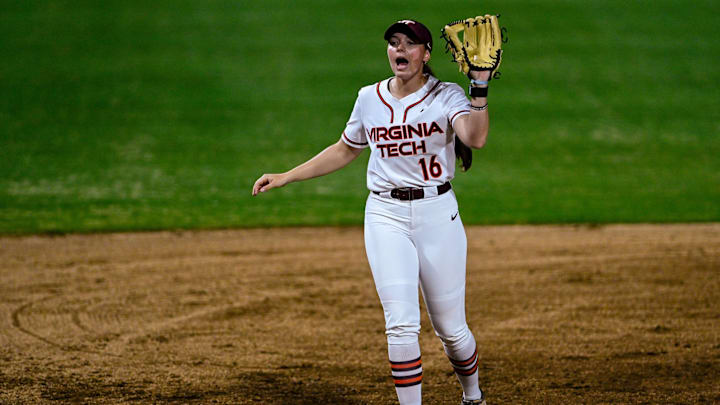 Jordan Lynch shows off her glove standing at the hot corner.