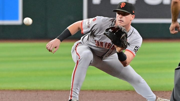 Sep 25, 2024; Phoenix, Arizona, USA; San Francisco Giants shortstop Tyler Fitzgerald (49) catches the ball to stop Arizona Diamondbacks outfielder Corbin Carroll (7) from stealing second base in the first inning at Chase Field.