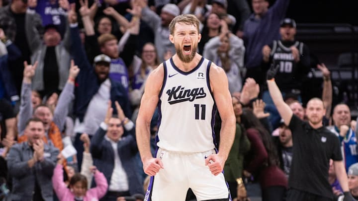 Jan 6, 2025; Sacramento, California, USA; Sacramento Kings forward Domantas Sabonis (11) reacts after making a three point shot against the Miami Heat during overtime at Golden 1 Center. Mandatory Credit: Ed Szczepanski-Imagn Images