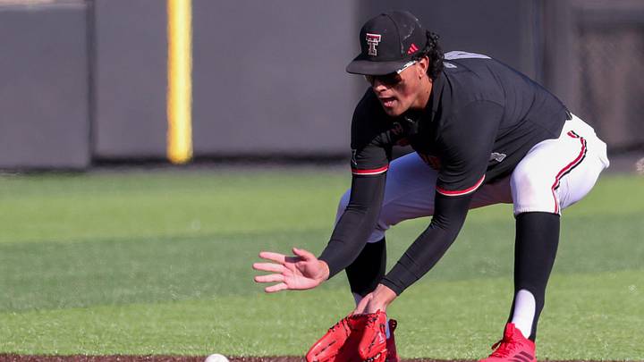 Texas Tech Red Raiders infielder Linkin Garcia fields a ground ball during the Texas Tech Baseball alumni game.