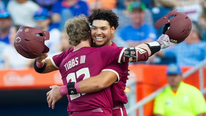 Florida State   s James Gibbs III is congratulated by Florida State   s Cam Smith (24) after Gibbs