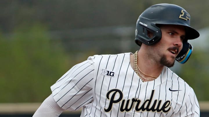 Purdue infielder Logan Sutter (10) rounds the bases after hitting a home run 