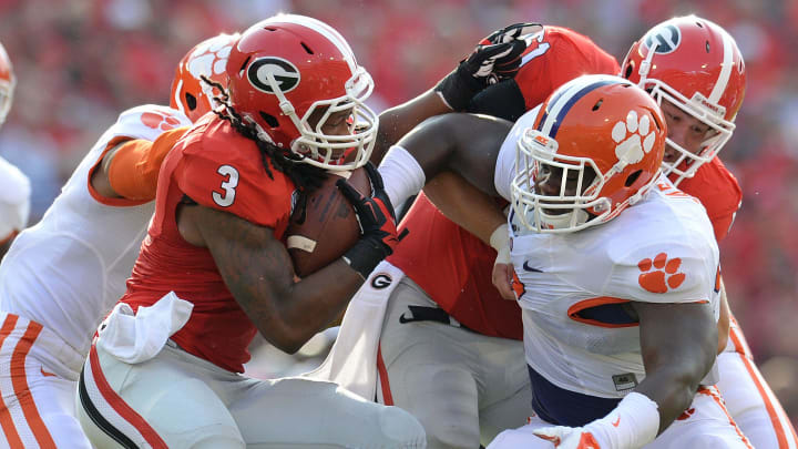 Clemson defensive end Vic Beasley (3), left, and defensive tackle Grady Jarrett (50) stop Georgia tailback Todd Gurley (3) during the 1st quarter at Georgia's Sanford Stadium Saturday, August 30, 2014.Clemson Georgia Football