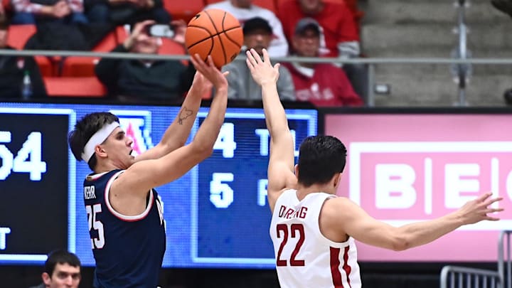 Jan 26, 2023; Pullman, Washington, USA; Arizona Wildcats guard Kerr Kriisa (25) shoots the ball against Washington State Cougars guard Dylan Darling (22) in the first half at Friel Court at Beasley Coliseum. Mandatory Credit: James Snook-Imagn Images