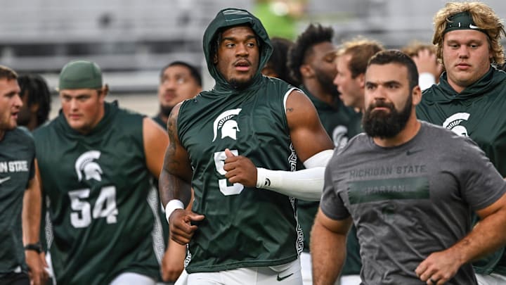 Michigan State's Jordan Hall, center, and the rest of the Spartans head back to the locker room before the game against Florida Atlantic on Friday, Aug. 30, 2024, at Spartan Stadium in East Lansing. Michigan State's Jordan Hall, center, and the rest of the Spartans head back to the locker room before the game against Florida Atlantic on Friday, Aug. 30, 2024, at Spartan Stadium in East Lansing.