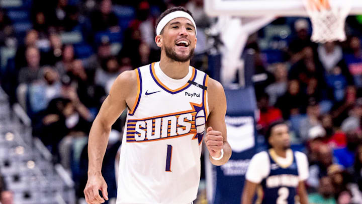 Dec 5, 2024; New Orleans, Louisiana, USA;  Phoenix Suns guard Devin Booker (1) reacts to having foul called against him against the New Orleans Pelicans during the second half  at Smoothie King Center. Mandatory Credit: Stephen Lew-Imagn Images