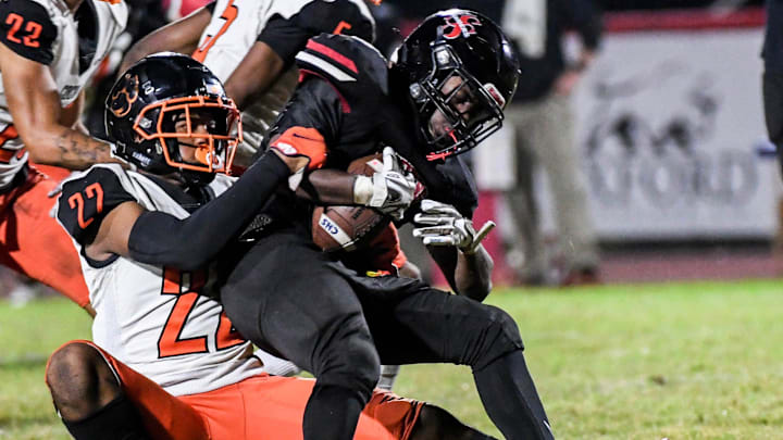 Jamare Dorsey of South Sumter is tackled by CJ Hester of Cocoa during their game in the FHSAA football Class 2S regional final. Craig Bailey/FLORIDA TODAY via USA TODAY NETWORK
High School Football Cocoa Vs South Sumter Jamare Dorsey of South Sumter is tackled by CJ Hester of Cocoa during their game in the FHSAA football Class 2S regional final. Craig Bailey/FLORIDA TODAY via USA TODAY NETWORK
High School Football Cocoa Vs South Sumter