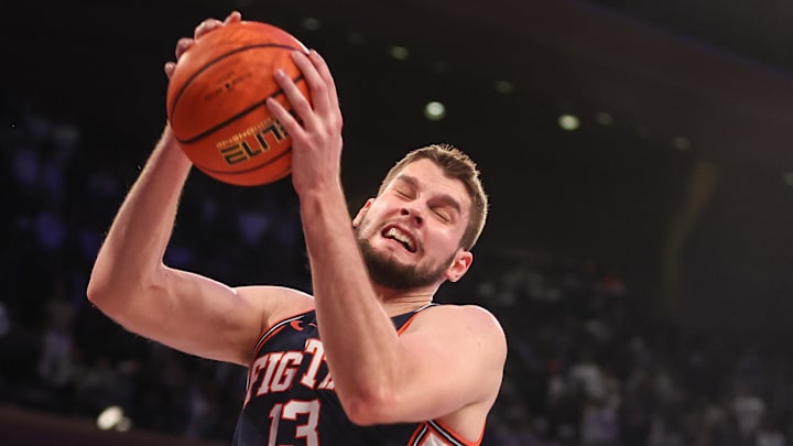 Nov 28, 2025; New York, New York, USA;  Illinois Fighting Illini center Tomislav Ivisic (13) grabs a rebound in the first half against the UConn Huskies at Madison Square Garden. Mandatory Credit: Wendell Cruz-Imagn Images