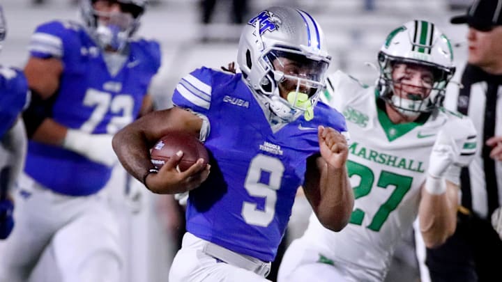 Middle Tennessee running back Jekail Middlebrook and Marshall linebacker Cannon Lewis 