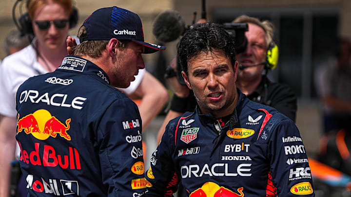 Oracle Red Bull Racing driver Max Verstappen, left, talks to Sergio Perez, right, after the Sprint Shootout at Circuit of Americas on Saturday Oct. 21, 2023 ahead of the Formula 1 Lenovo United States Grand Prix on Sunday.