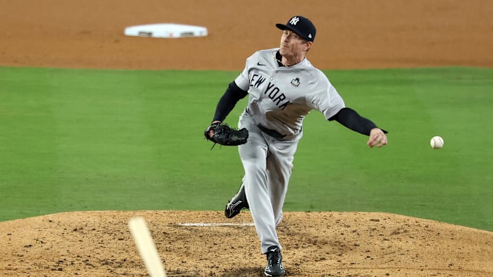 Oct 26, 2024; Los Angeles, California, USA; New York Yankees pitcher Tim Hill (54) throws a pitch against the Los Angeles Dodgers  in the fifth inning for game two of the 2024 MLB World Series at Dodger Stadium. Mandatory Credit: Kiyoshi Mio-Imagn Images