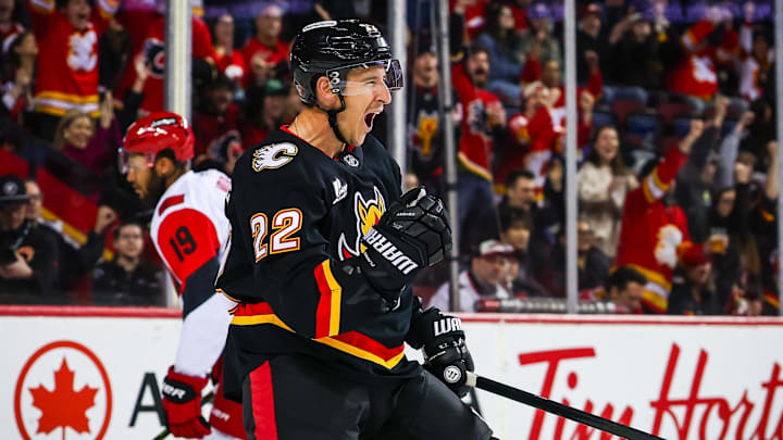 Mar 7, 2026; Calgary, Alberta, CAN; Calgary Flames center Ryan Strome (22) scores a goal against the Carolina Hurricanes during the second period at Scotiabank Saddledome. Mandatory Credit: Sergei Belski-Imagn Images