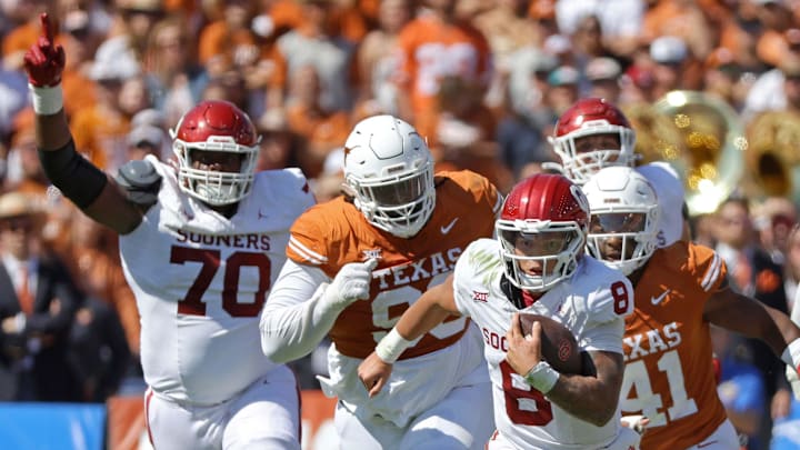 Oklahoma Sooners quarterback Dillon Gabriel runs away from Texas.