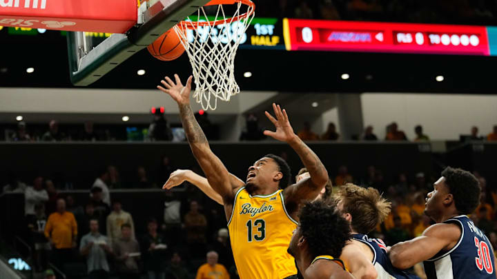 Feb 17, 2025; Waco, Texas, USA;  Baylor Bears guard Langston Love (13) scores a basket against the Arizona Wildcats during the first half at Paul and Alejandra Foster Pavilion. Mandatory Credit: Chris Jones-Imagn Images