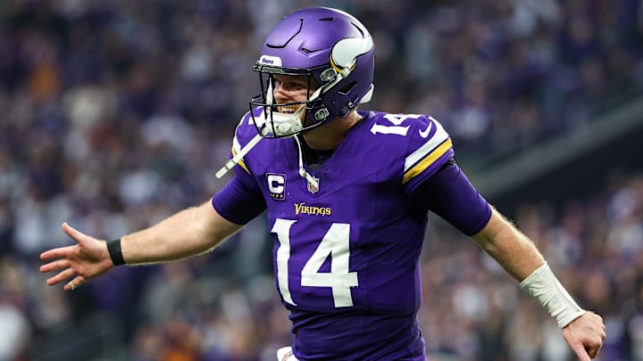 Dec 8, 2024; Minneapolis, Minnesota, USA; Minnesota Vikings quarterback Sam Darnold (14) celebrates running back Aaron Jones' (33) touchdown run against the Atlanta Falcons during the fourth quarter at U.S. Bank Stadium. Mandatory Credit: Matt Krohn-Imagn Images